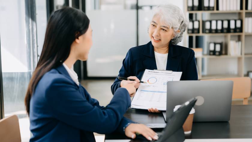 Business owners organizing financial records with the help of a CPA during tax season.